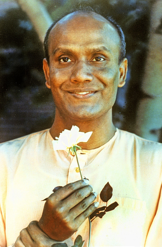 young_sri-chinmoy-holding_flower.jpg